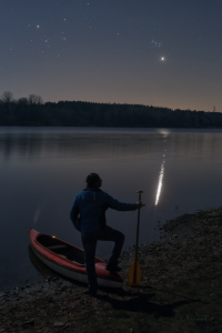 Canoeist stargazing