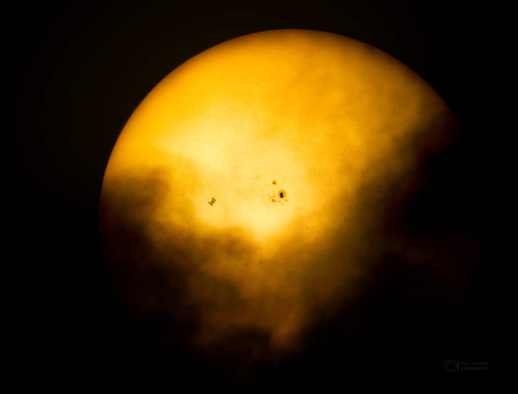 Space Station and Cloudy, Spotted Sun