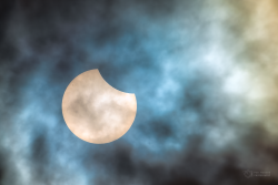 Partial solar eclipse on 29 March 2025 through clouds